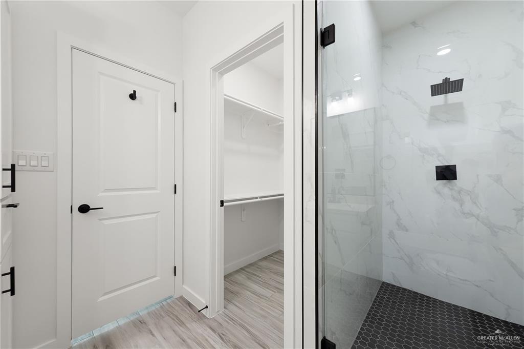 518 East E Loop, Unit 10 Harlingen, TX 78550 - Photo 13 of 14 a bathroom with a shower and a toilet