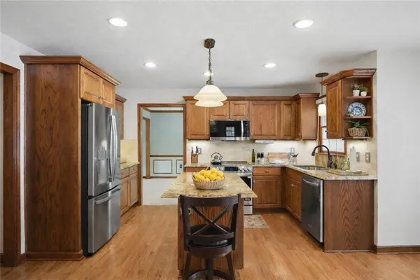 a dining room with furniture window and wooden floor
