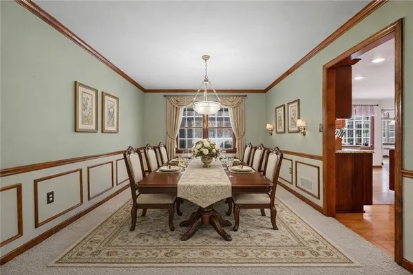 a view of a livingroom with an empty space and chair