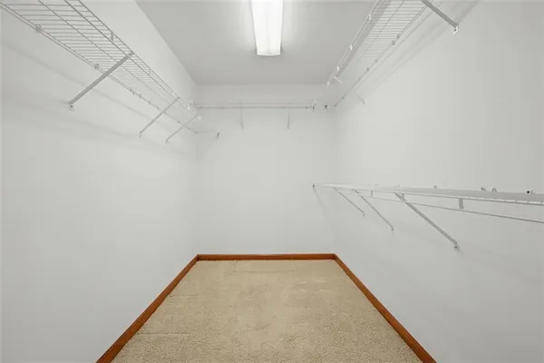 a bathroom with a tub a sink and a mirror