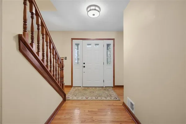 a view of a workspace with furniture window and wooden floor