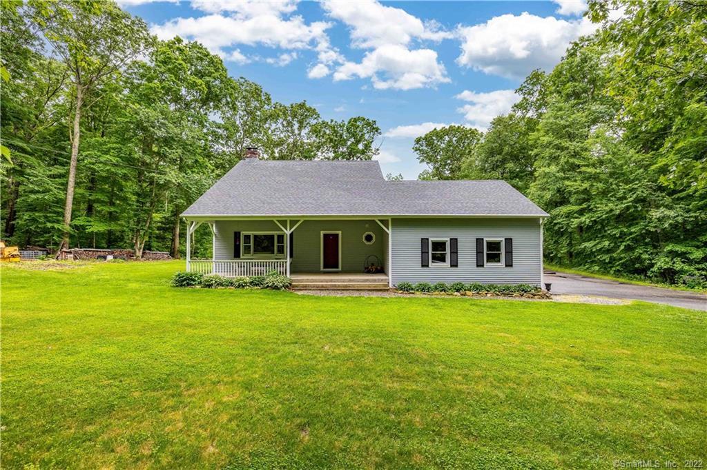 515 Tower Hill Road Chaplin, CT 06235 - Photo 1 of 1 a front view of a house with garden