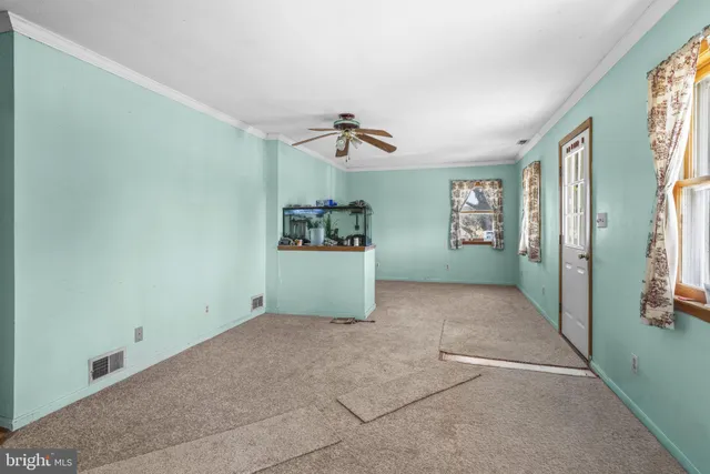 a living room with furniture and window