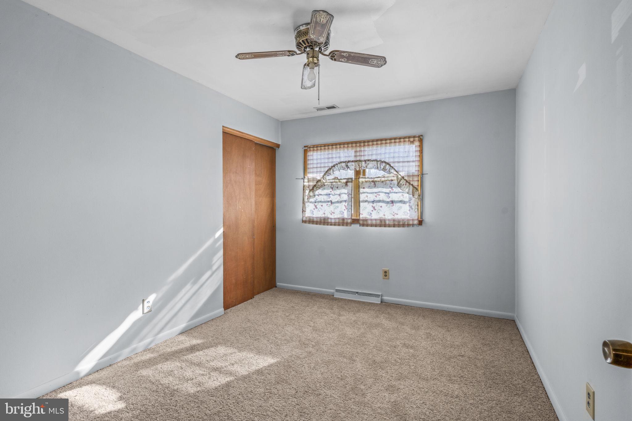 16400 Tanyard Road Upper Marlboro, MD 20772 - Photo 20 of 30 a view of room with window and ceiling fan