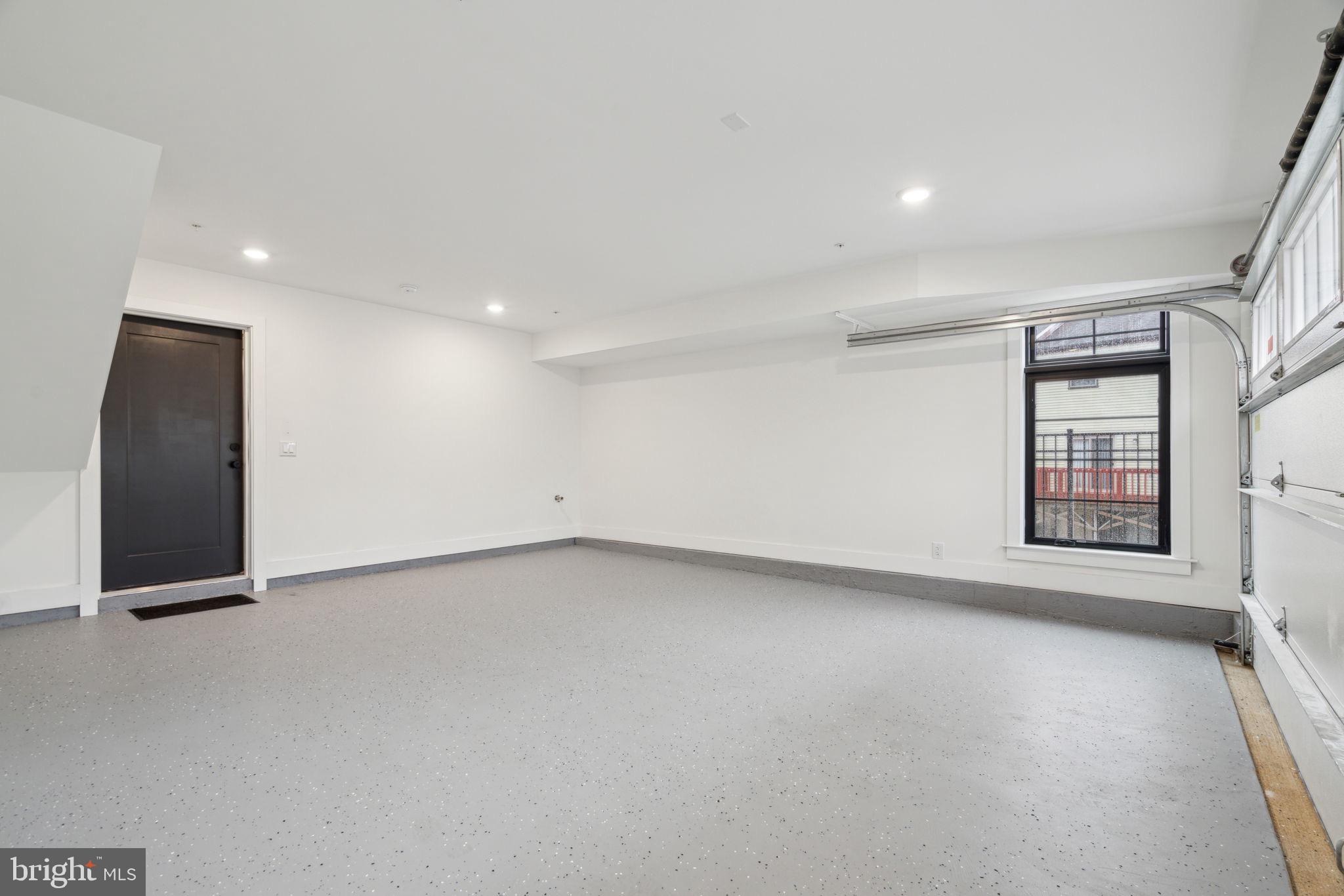 7519 Ridge Avenue, Unit 301 Philadelphia, PA 19128 - Photo 13 of 37 an empty room with windows
