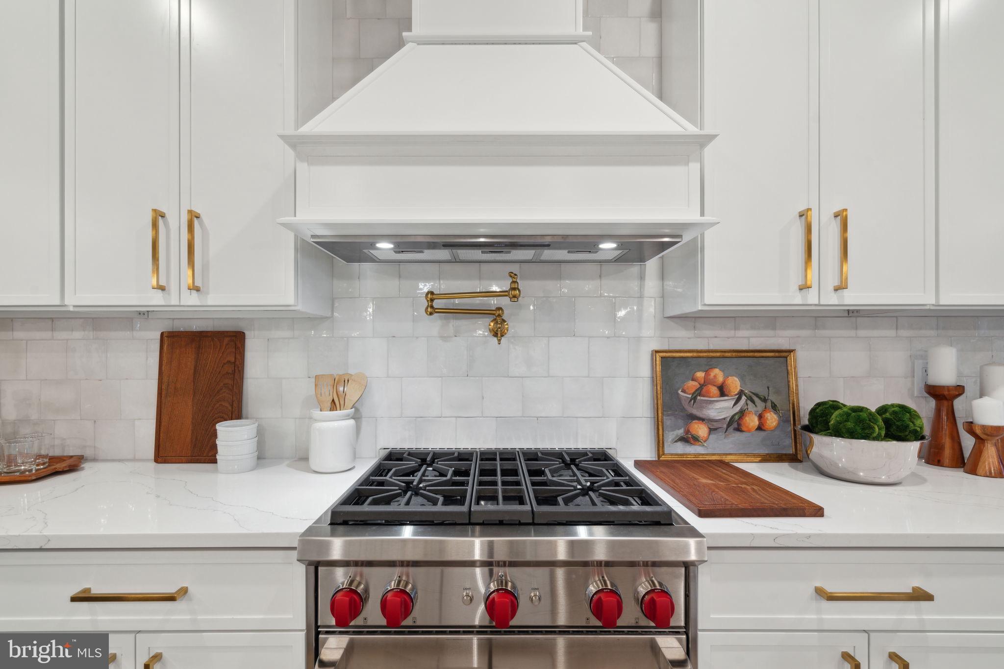 7519 Ridge Avenue, Unit 301 Philadelphia, PA 19128 - Photo 14 of 37 a stove top oven sitting inside of a kitchen