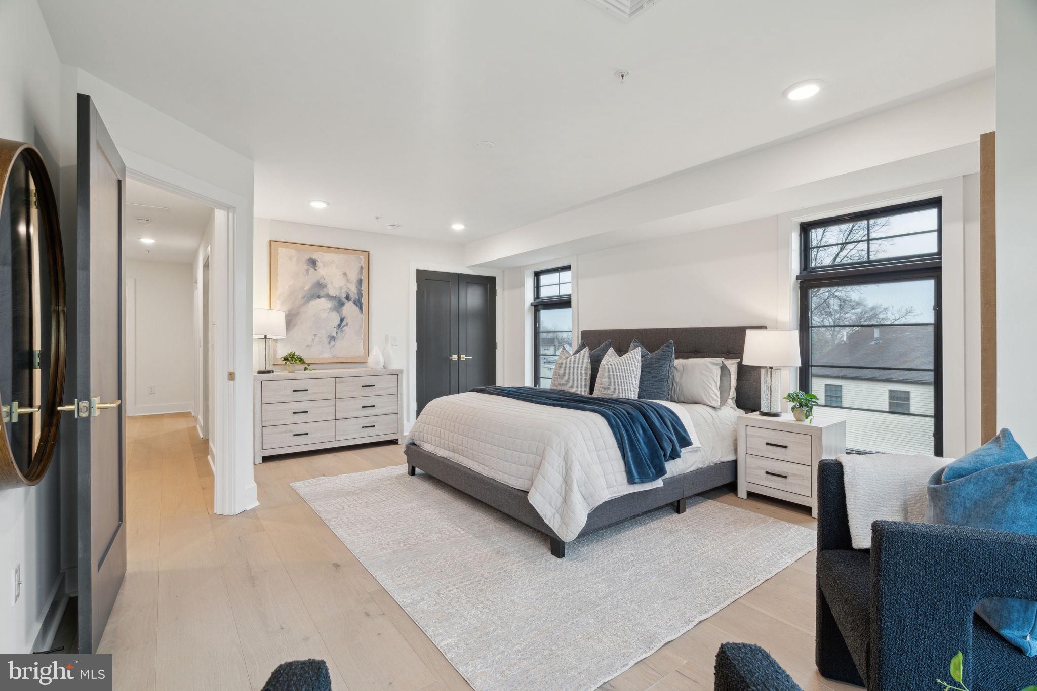 7519 Ridge Avenue, Unit 301 Philadelphia, PA 19128 - Photo 22 of 37 a bedroom with a large bed and a window