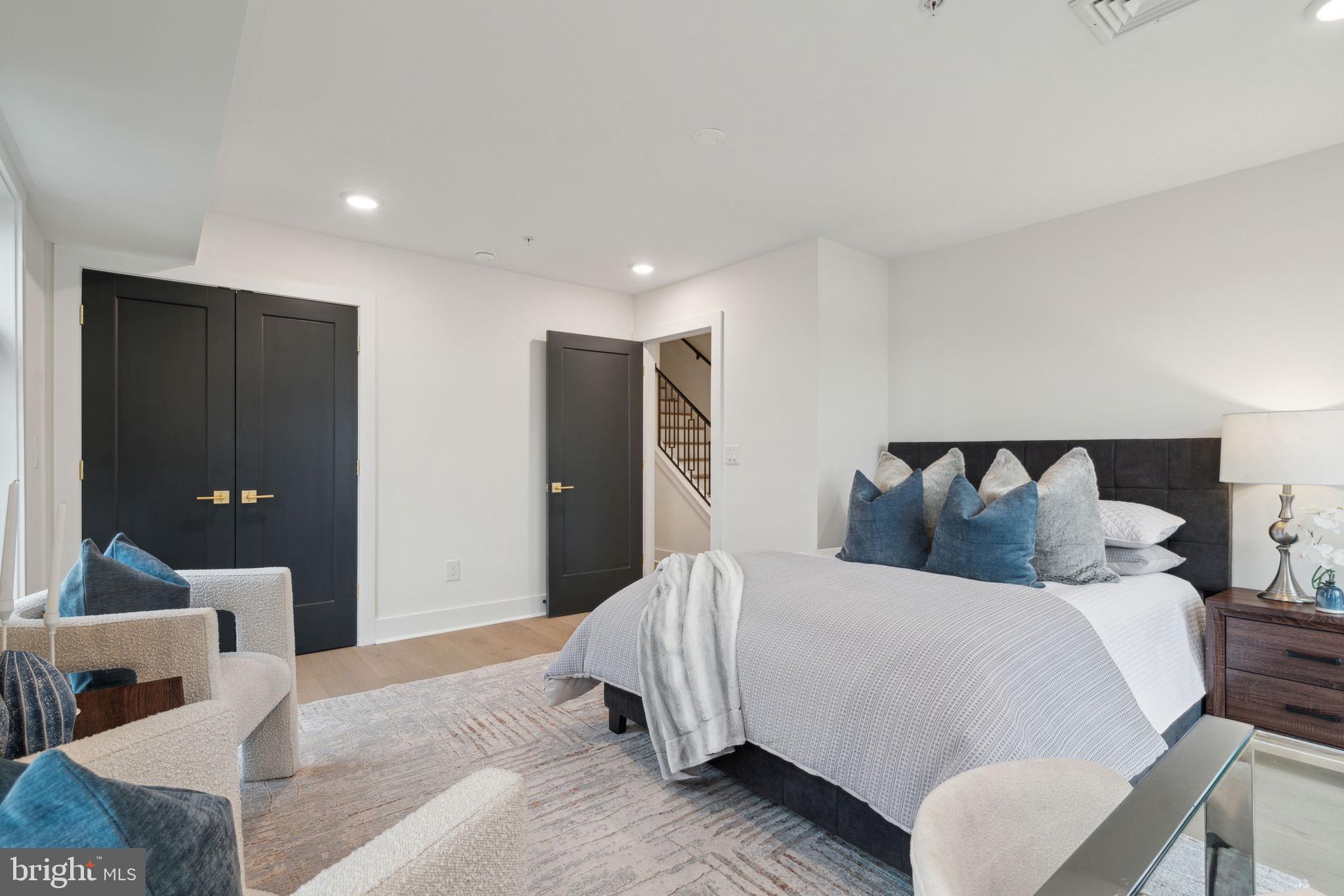 7519 Ridge Avenue, Unit 301 Philadelphia, PA 19128 - Photo 26 of 37 a bed room with a bed and a couch