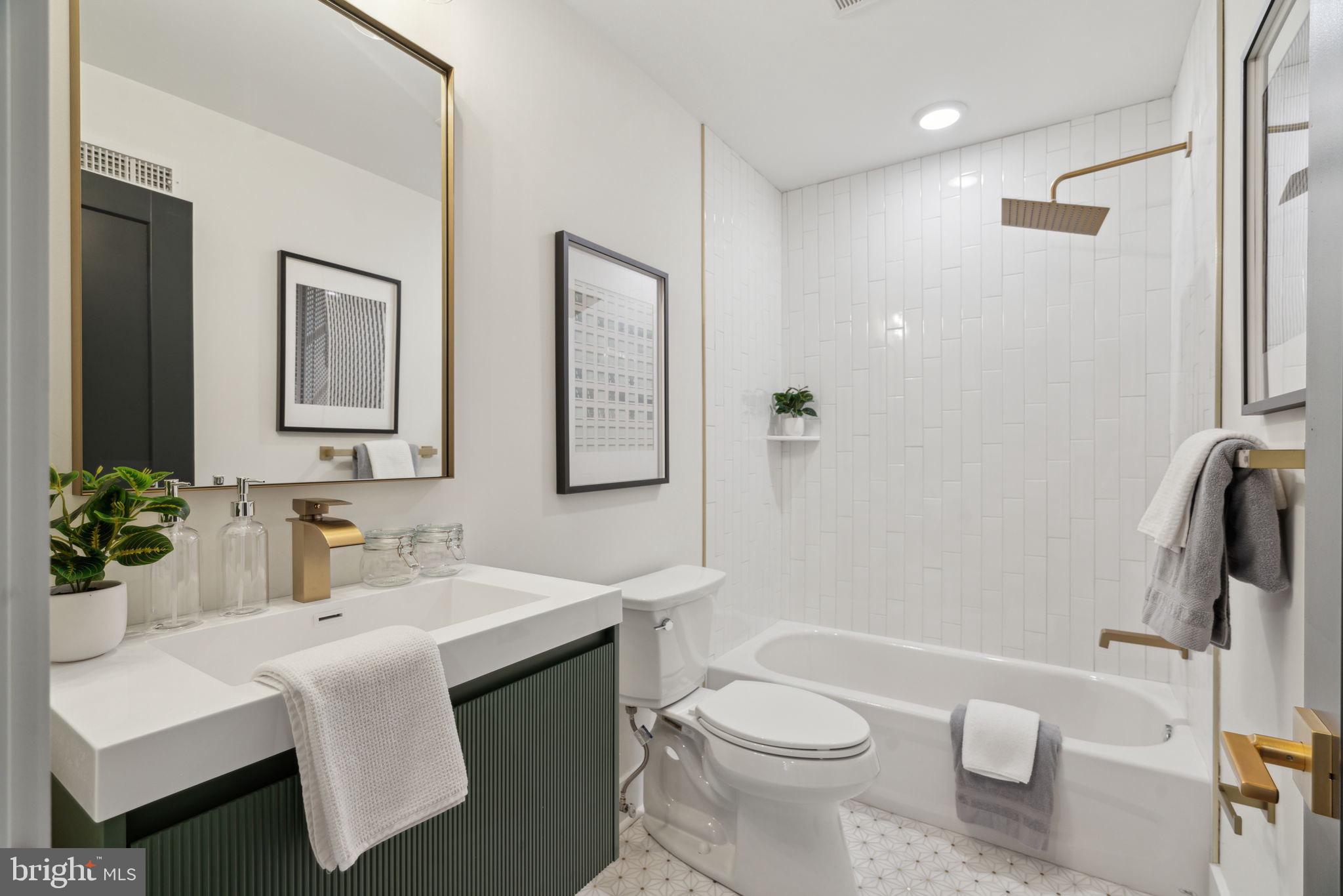7519 Ridge Avenue, Unit 301 Philadelphia, PA 19128 - Photo 28 of 37 a bathroom with a sink toilet and shower