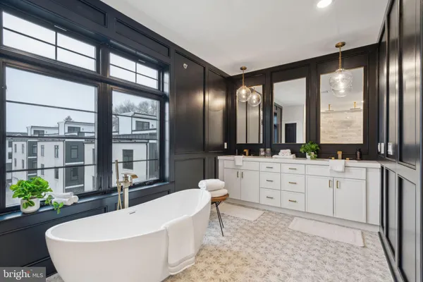 a bathroom with a sink vanity and a mirror