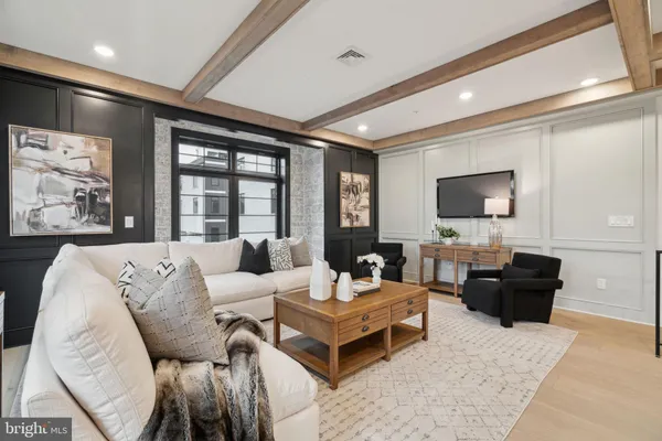 a living room with furniture and a table