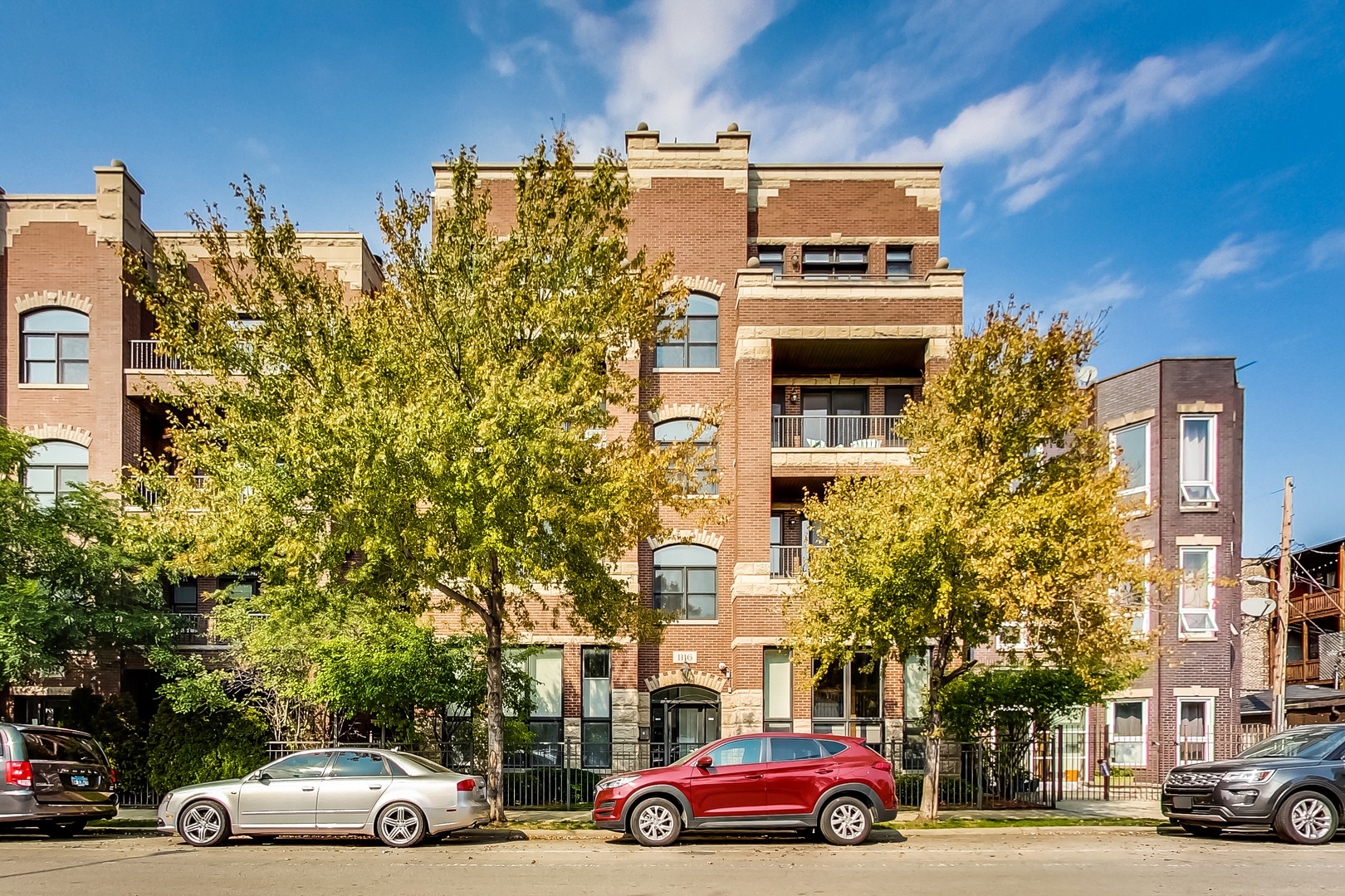 1116 West Hubbard Street, Unit 4W Chicago, IL 60642 - Photo 1 of 32 a view of cars parked in front of a building