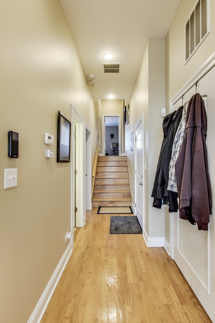 1116 West Hubbard Street, Unit 4W Chicago, IL 60642 - Photo 14 of 32 a view of a hallway with closet and mirror