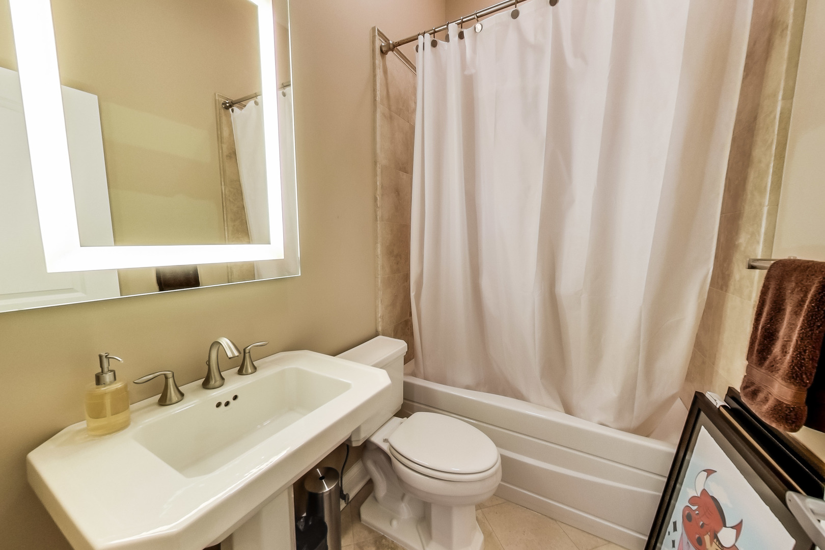 1116 West Hubbard Street, Unit 4W Chicago, IL 60642 - Photo 15 of 32 a bathroom with a sink and a mirror