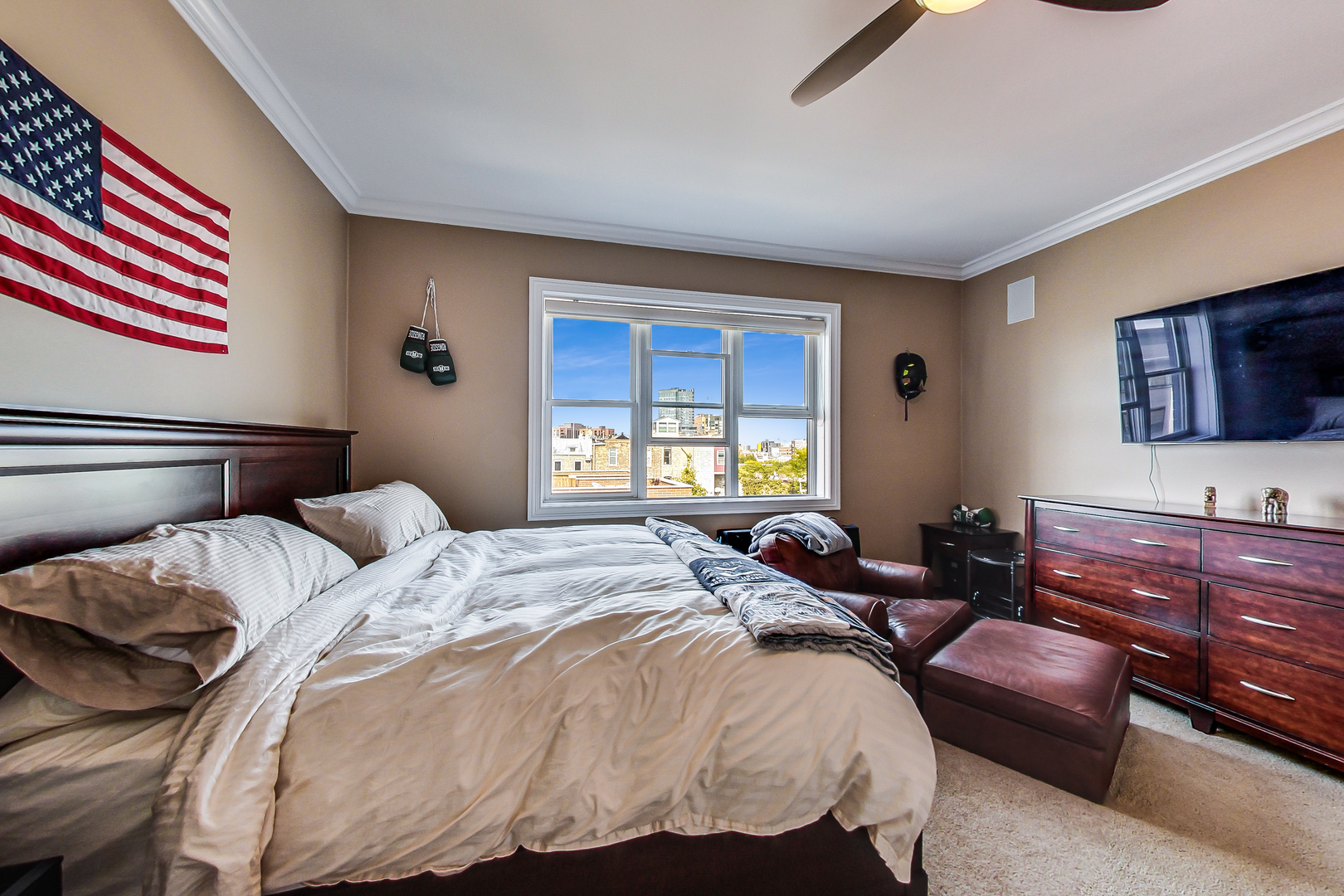 1116 West Hubbard Street, Unit 4W Chicago, IL 60642 - Photo 20 of 32 a bedroom with a bed and wooden floor