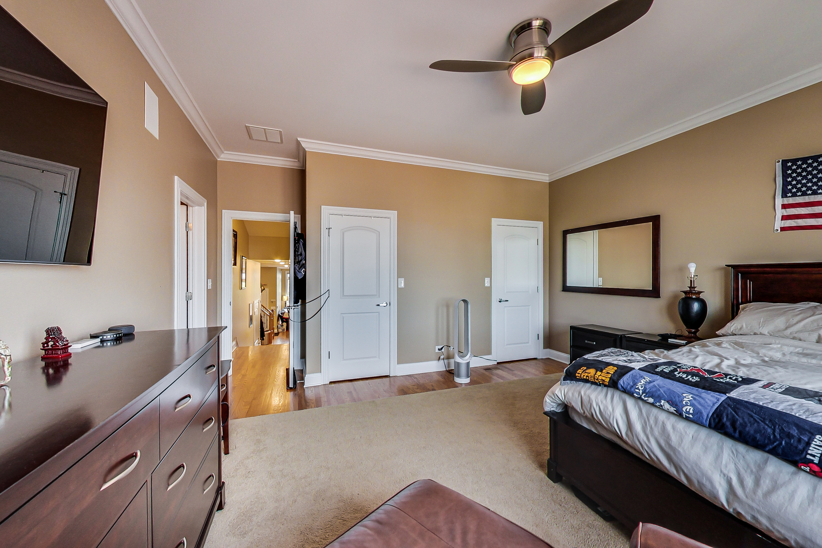 1116 West Hubbard Street, Unit 4W Chicago, IL 60642 - Photo 21 of 32 a bedroom with a bed and a chandelier