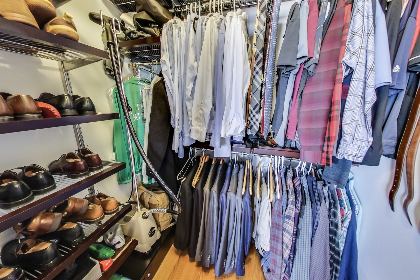 1116 West Hubbard Street, Unit 4W Chicago, IL 60642 - Photo 22 of 32 a view of walk in closet with clothes and shoes