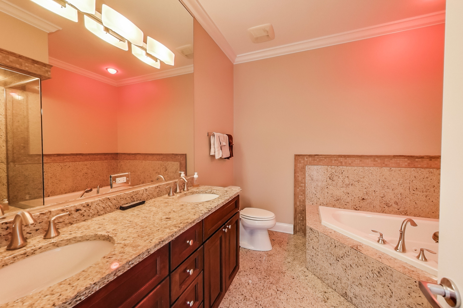 1116 West Hubbard Street, Unit 4W Chicago, IL 60642 - Photo 23 of 32 a bathroom with a granite countertop sink and a bathtub