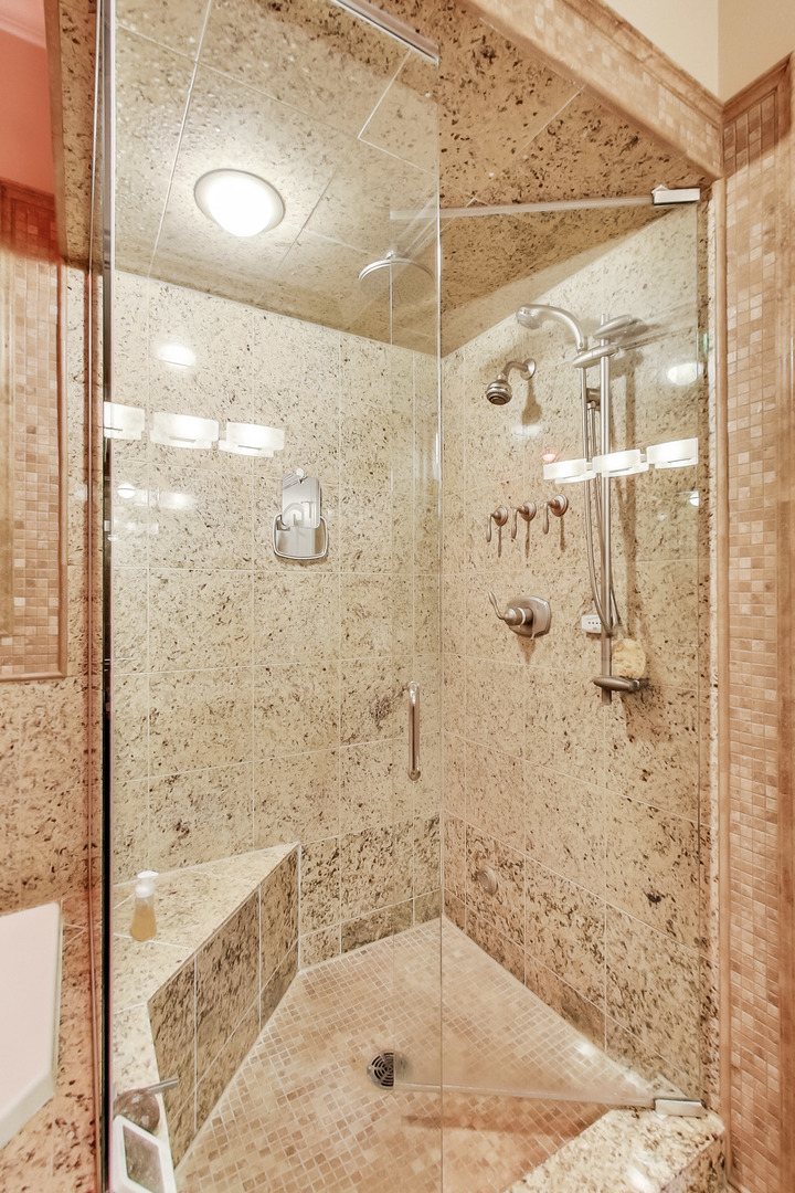 1116 West Hubbard Street, Unit 4W Chicago, IL 60642 - Photo 24 of 32 a bathroom with a bathtub and shower