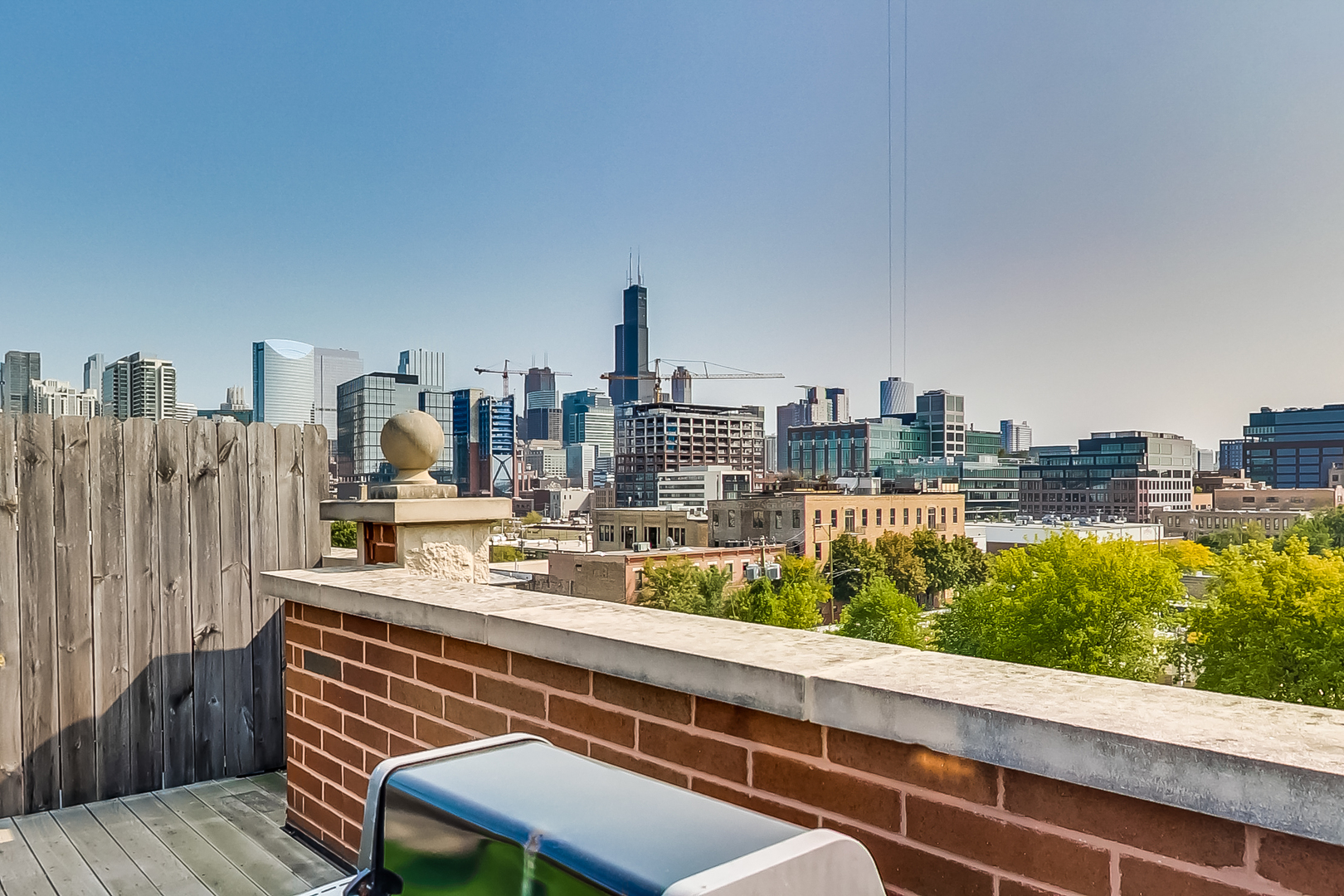 1116 West Hubbard Street, Unit 4W Chicago, IL 60642 - Photo 30 of 32 a view of a city from a balcony with city view