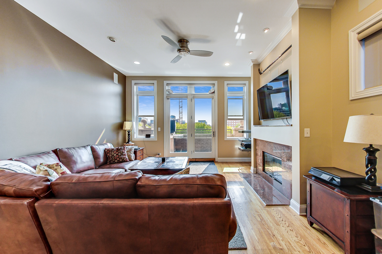 1116 West Hubbard Street, Unit 4W Chicago, IL 60642 - Photo 4 of 32 a living room with furniture and a fireplace
