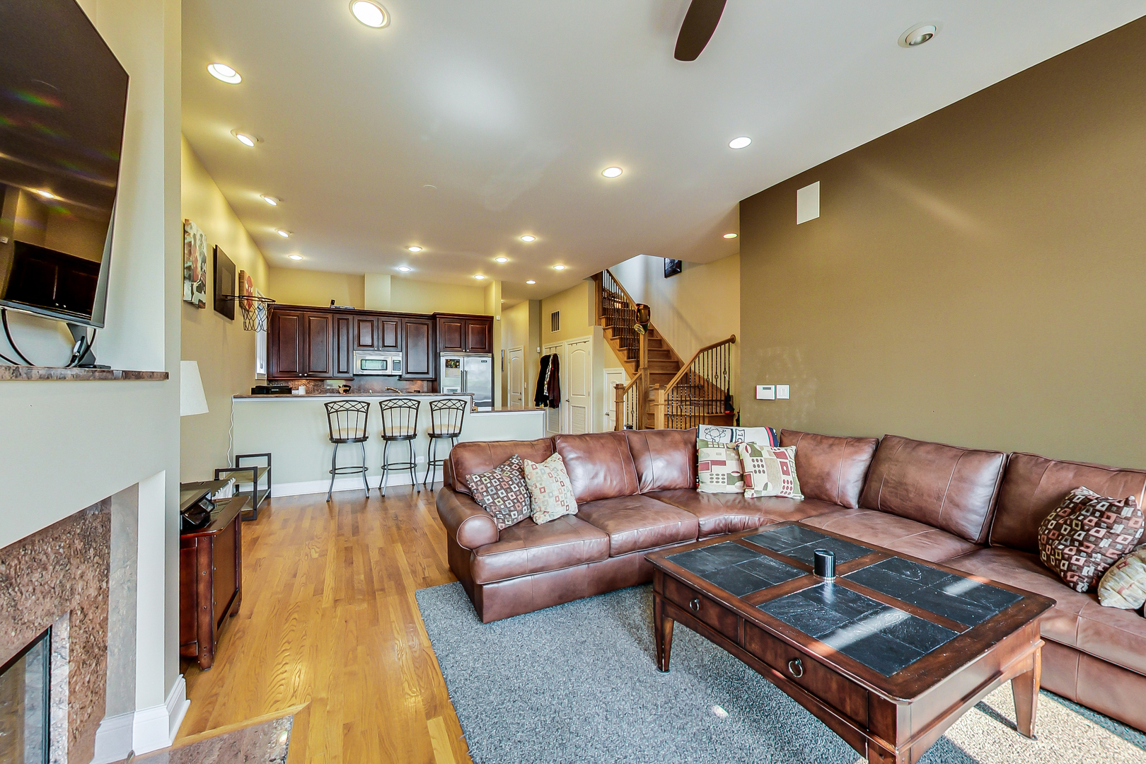 1116 West Hubbard Street, Unit 4W Chicago, IL 60642 - Photo 5 of 32 a living room with furniture kitchen view and a flat screen tv
