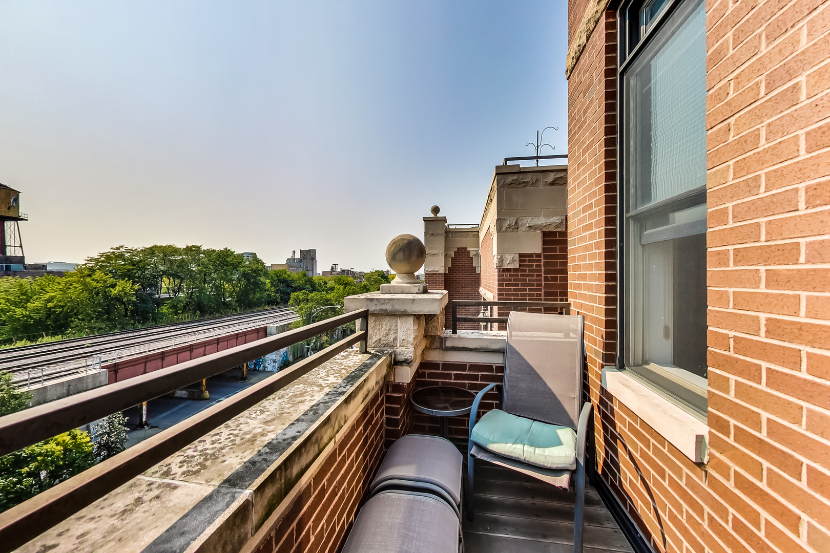 1116 West Hubbard Street, Unit 4W Chicago, IL 60642 - Photo 9 of 32 a view of balcony with chairs