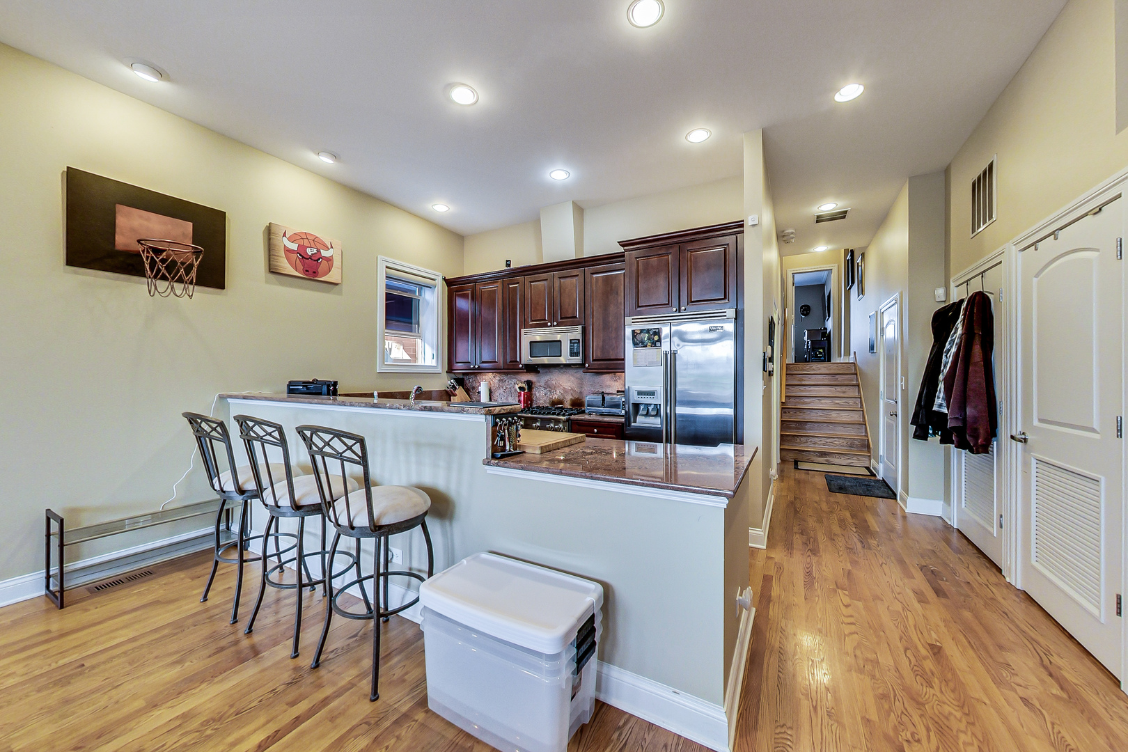 1116 West Hubbard Street, Unit 4W Chicago, IL 60642 - Photo 10 of 32 a kitchen with stainless steel appliances granite countertop a refrigerator a stove top oven a sink dishwasher and wooden floor