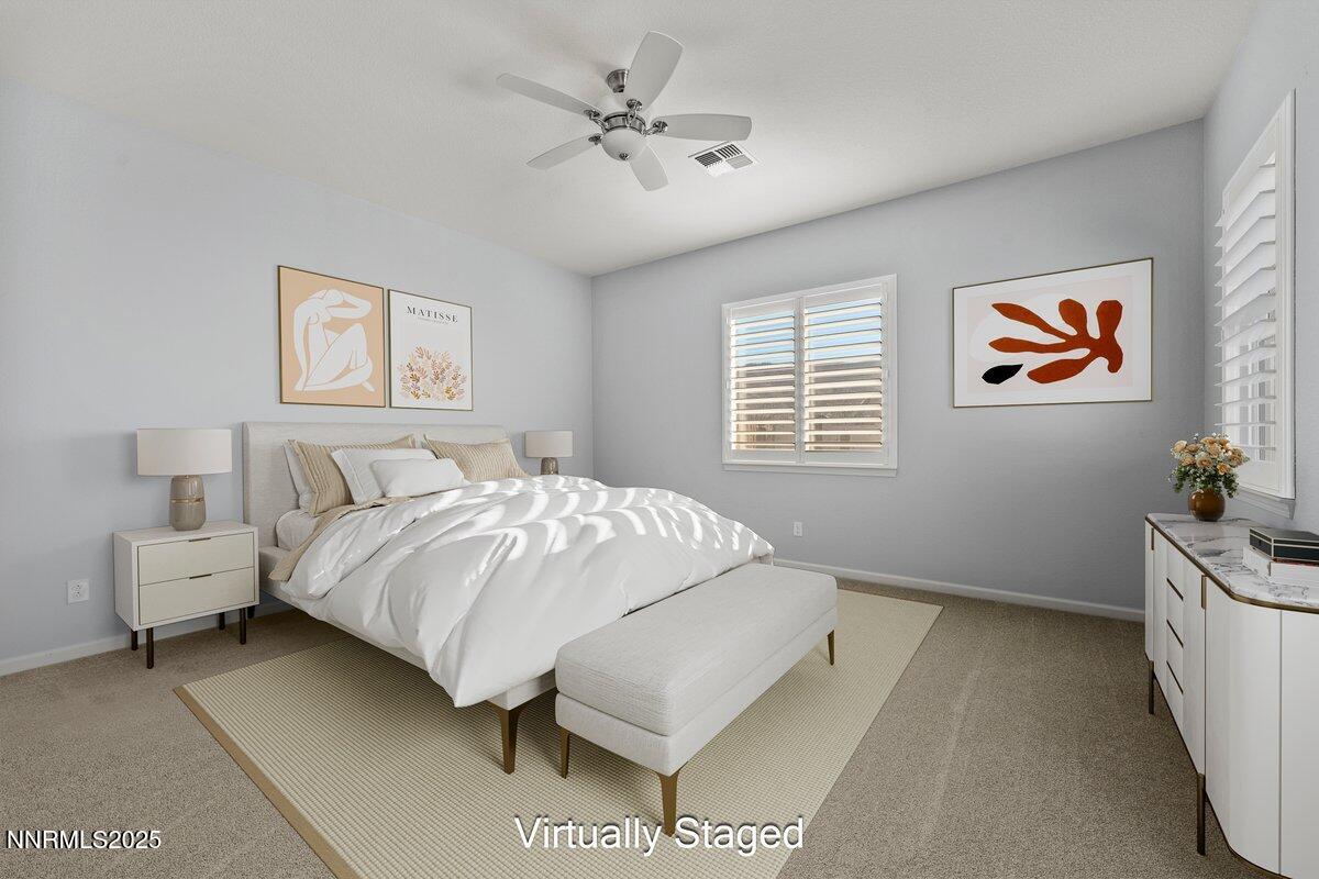 2250 Trakehner Lane Reno, NV 89521 - Photo 19 of 51 a bedroom with a bed and a painting on the wall