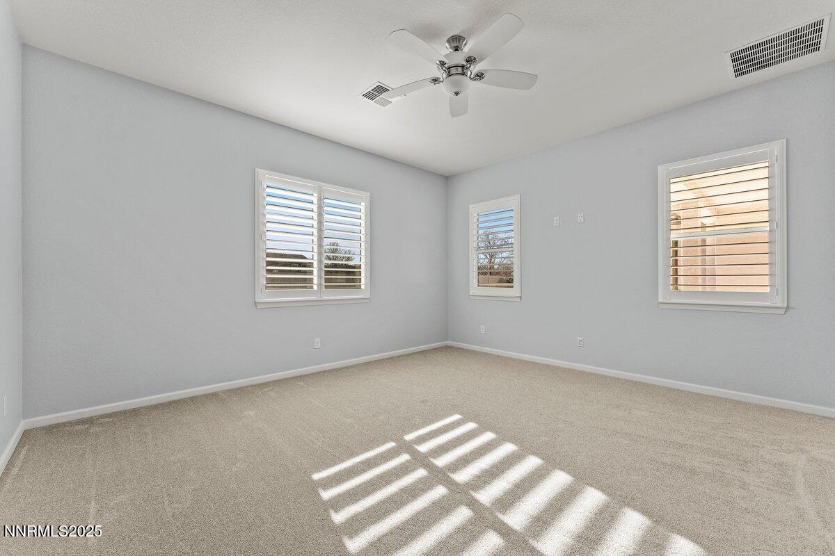 2250 Trakehner Lane Reno, NV 89521 - Photo 20 of 51 a view of an empty room with a window