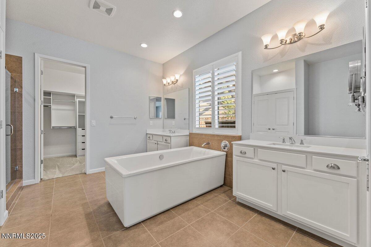 2250 Trakehner Lane Reno, NV 89521 - Photo 21 of 51 a spacious bathroom with a tub sink shower and mirror