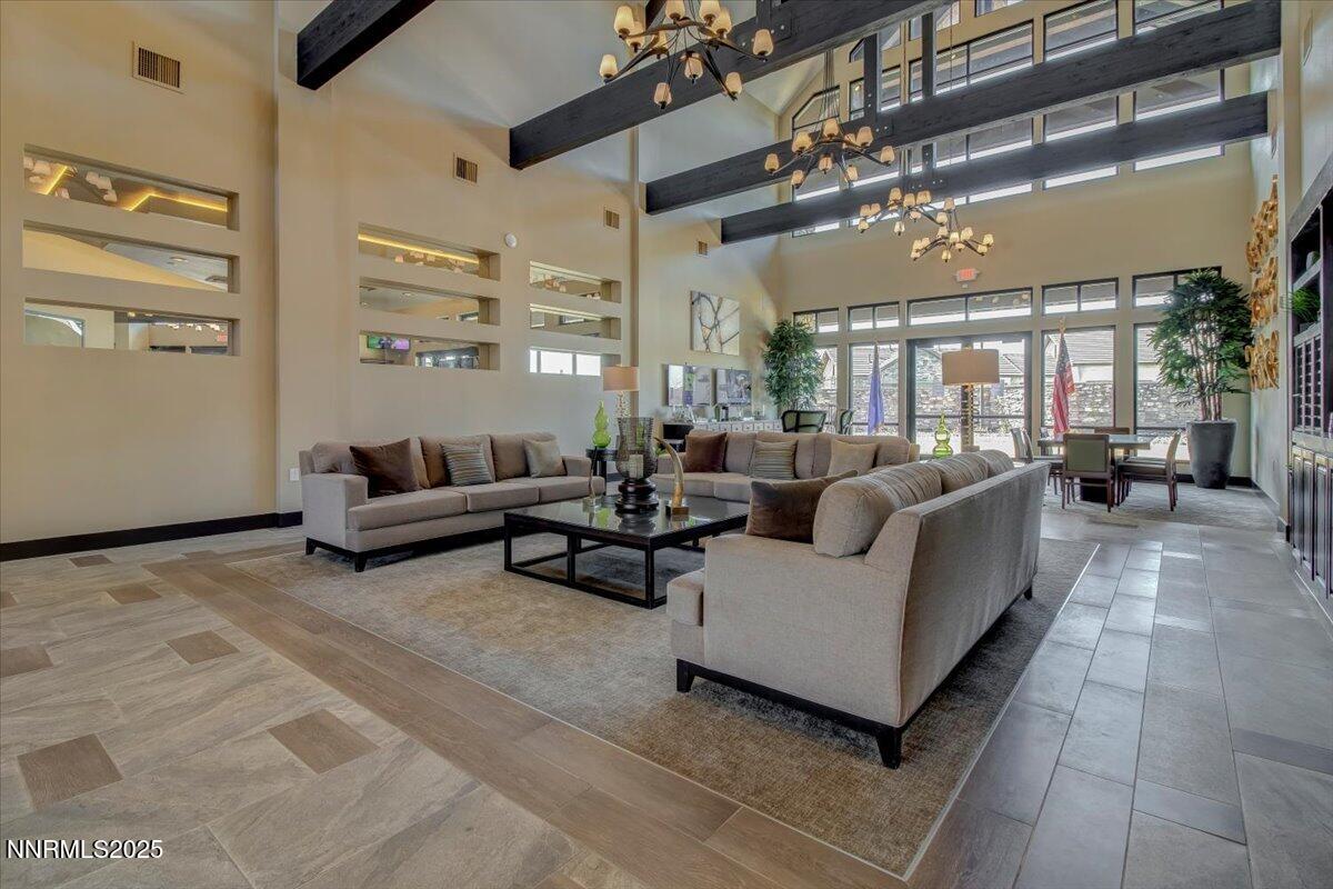2250 Trakehner Lane Reno, NV 89521 - Photo 40 of 51 a living room with furniture and a chandelier
