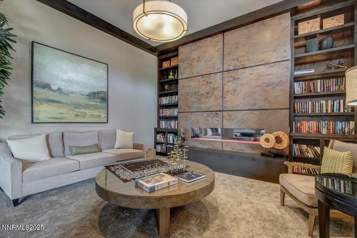 2250 Trakehner Lane Reno, NV 89521 - Photo 41 of 51 a living room with furniture and a book shelf