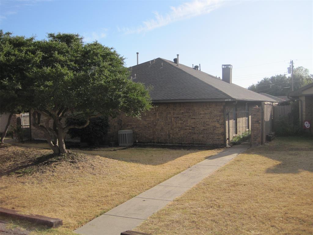 6478 Argo Street Dallas, TX 75214 - Photo 1 of 15 a front view of a house with a yard and garage