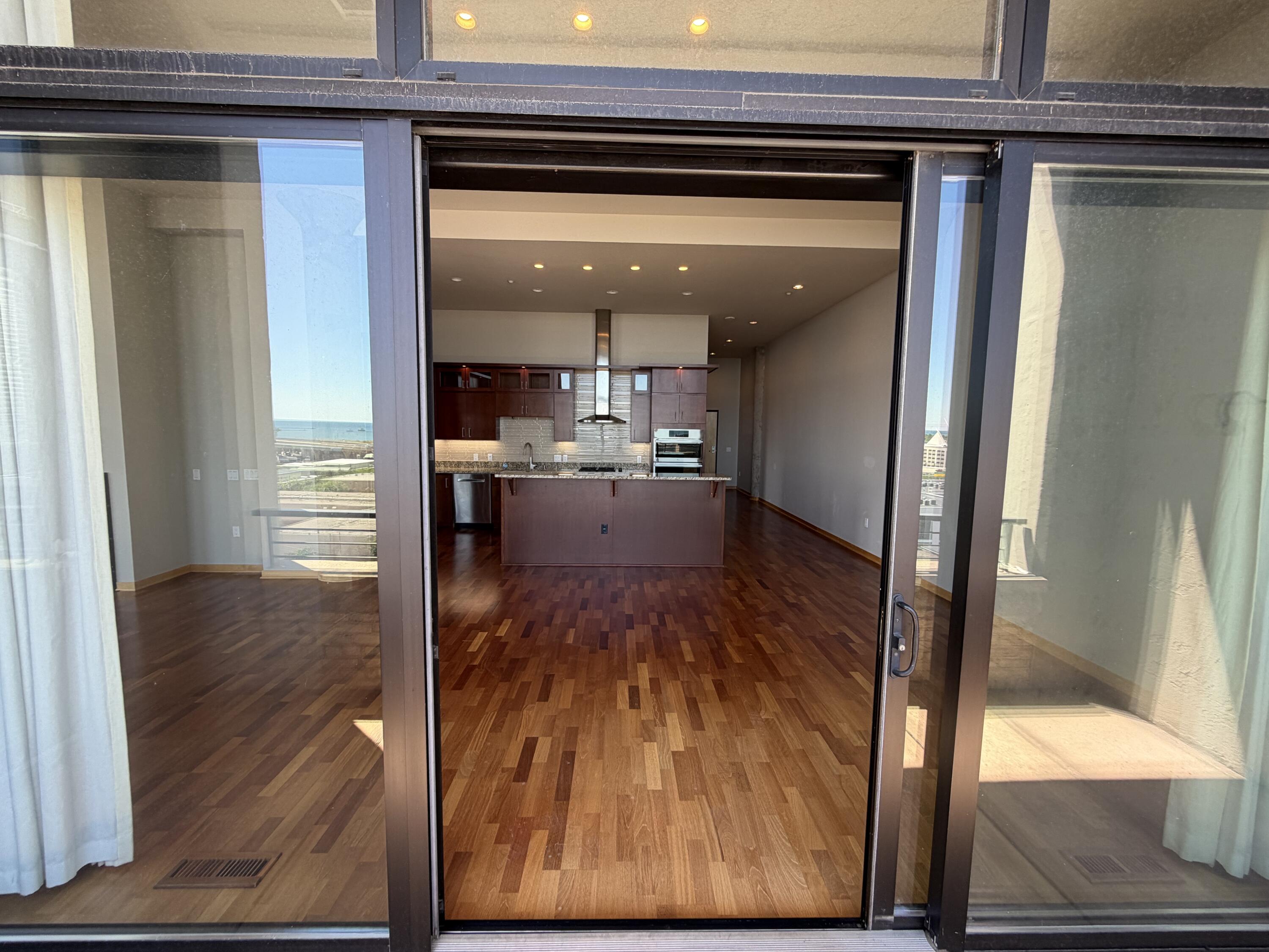 320 East Buffalo Street, Unit 803 Milwaukee, WI 53202 - Photo 13 of 31 Large sliding door from balcony to Great-room
