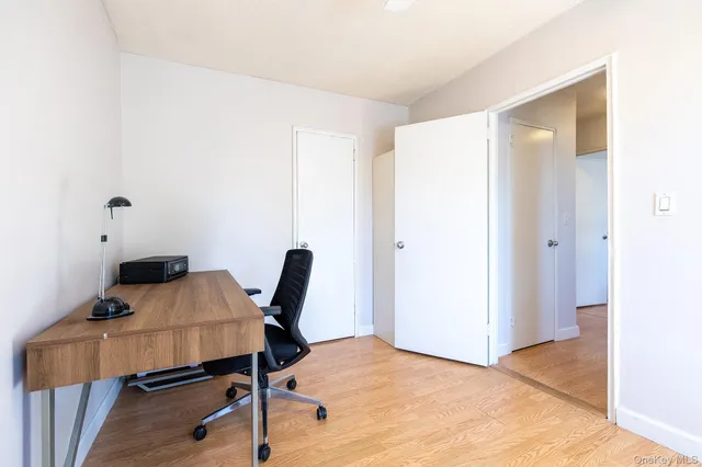 a workspace with furniture and wooden floor
