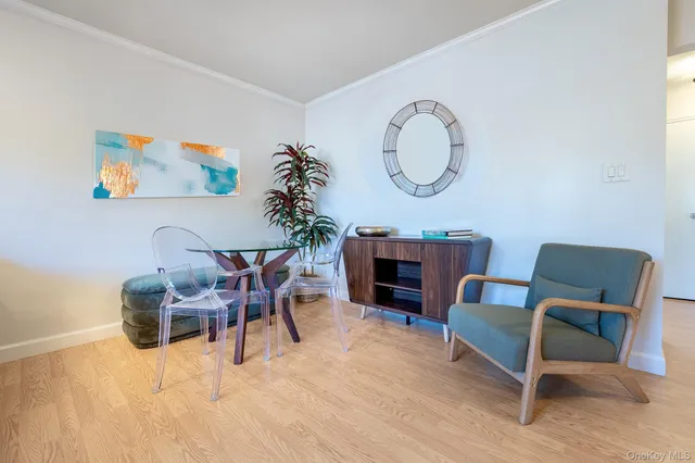 a dining room with furniture and a mirror