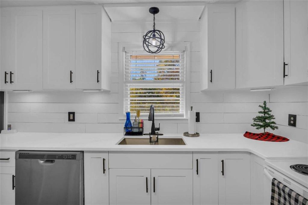 97 Williams Street Toccoa, GA 30577 - Photo 13 of 55 a kitchen with a sink and cabinets