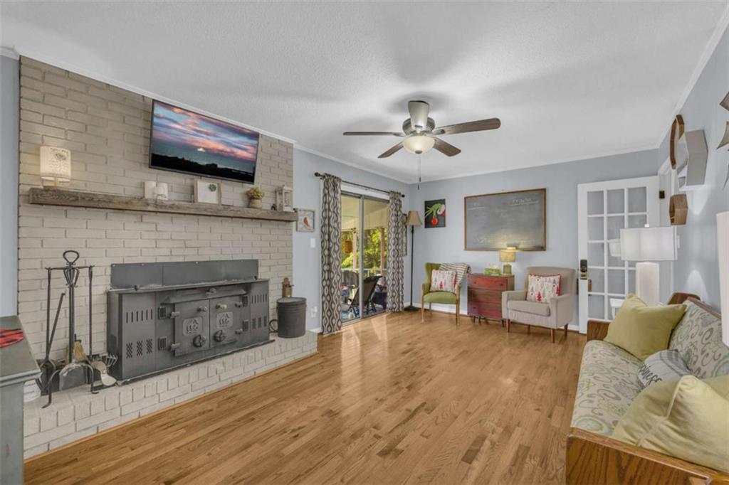 97 Williams Street Toccoa, GA 30577 - Photo 19 of 55 a living room with furniture and a fireplace