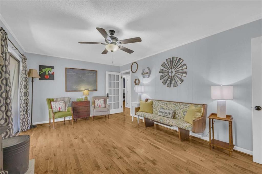 97 Williams Street Toccoa, GA 30577 - Photo 20 of 55 a living room with furniture and a wooden floor