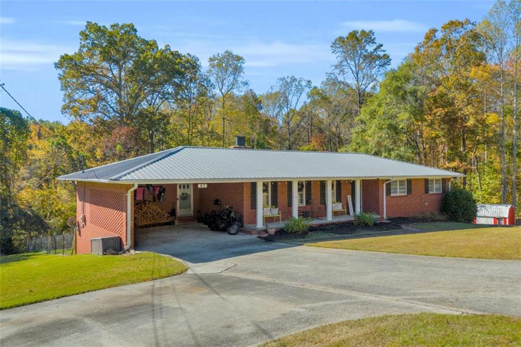 97 Williams Street Toccoa, GA 30577 - Photo 2 of 55 a front view of a house with a yard and trees