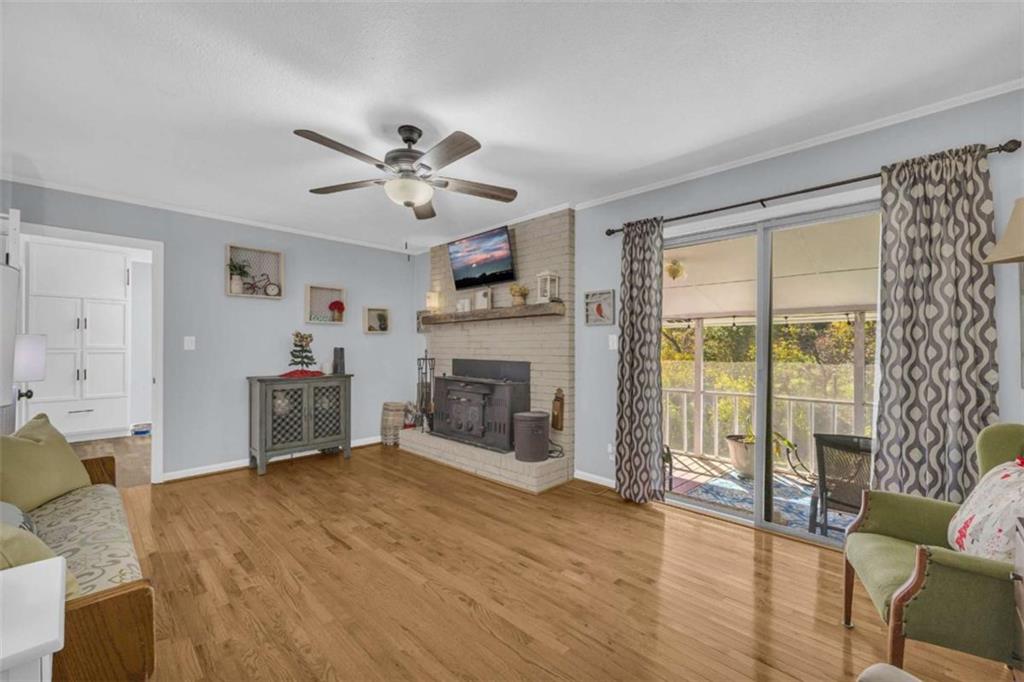 97 Williams Street Toccoa, GA 30577 - Photo 21 of 55 a living room with furniture and a fireplace