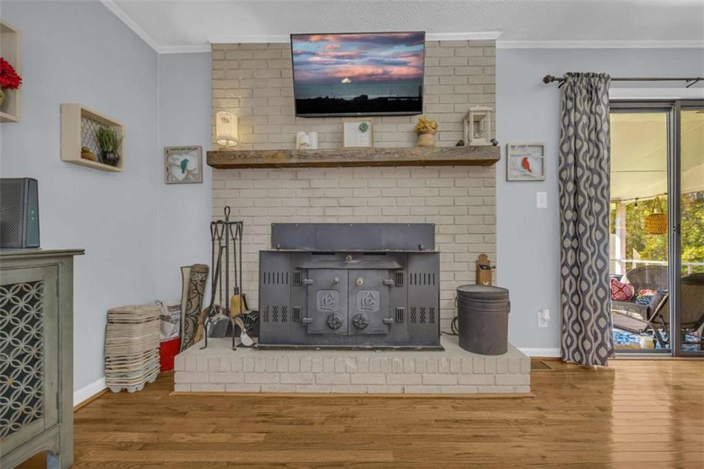97 Williams Street Toccoa, GA 30577 - Photo 23 of 55 a living room with furniture and a fireplace