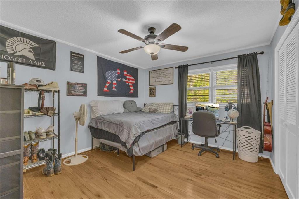 97 Williams Street Toccoa, GA 30577 - Photo 25 of 55 a bedroom with a bed and wooden floor