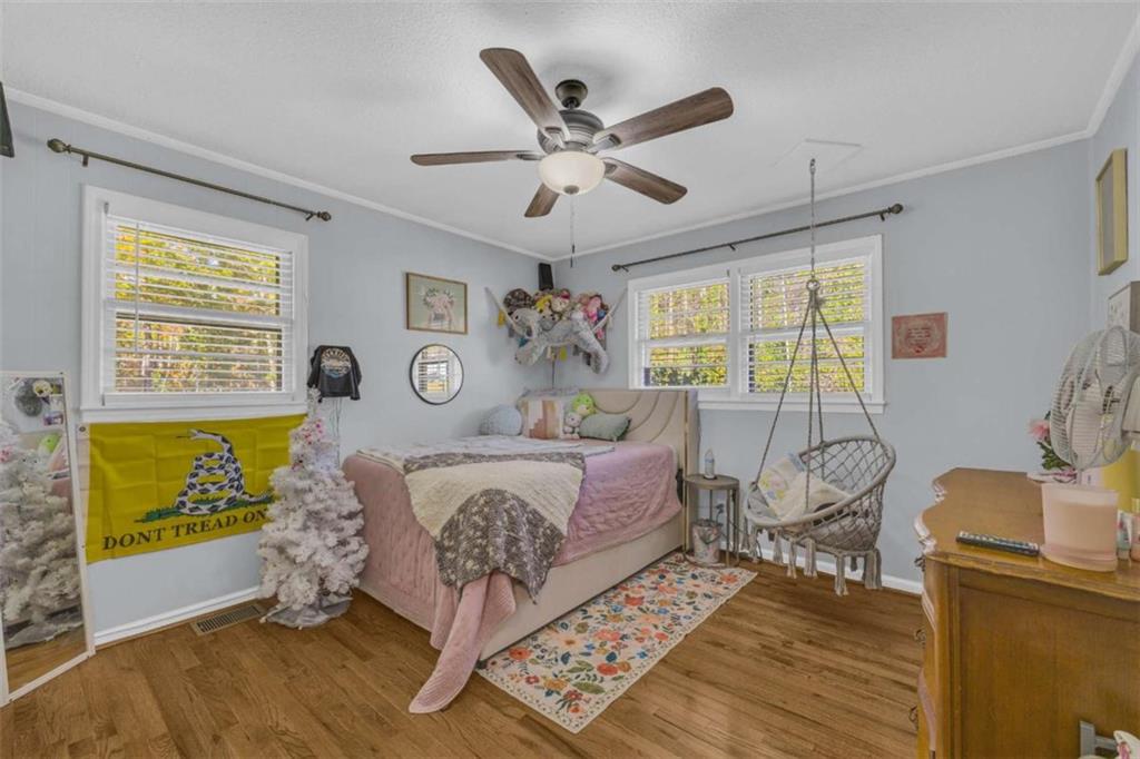 97 Williams Street Toccoa, GA 30577 - Photo 26 of 55 a bed room with a bed and a chandelier