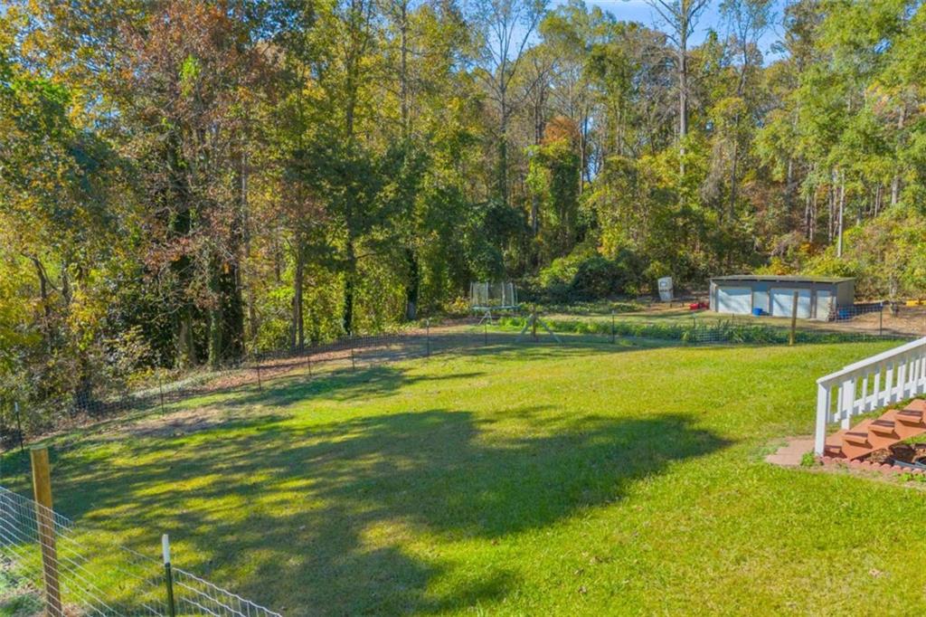 97 Williams Street Toccoa, GA 30577 - Photo 35 of 55 a view of a swimming pool with a big yard and large trees