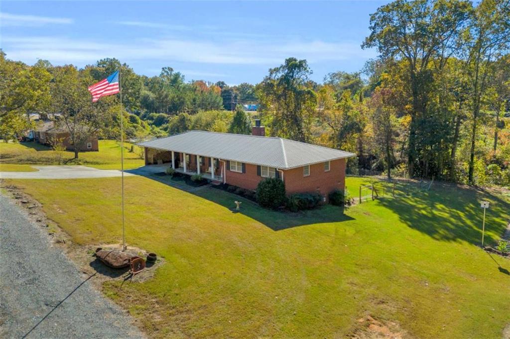 97 Williams Street Toccoa, GA 30577 - Photo 4 of 55 a view of a swimming pool with lounge chair