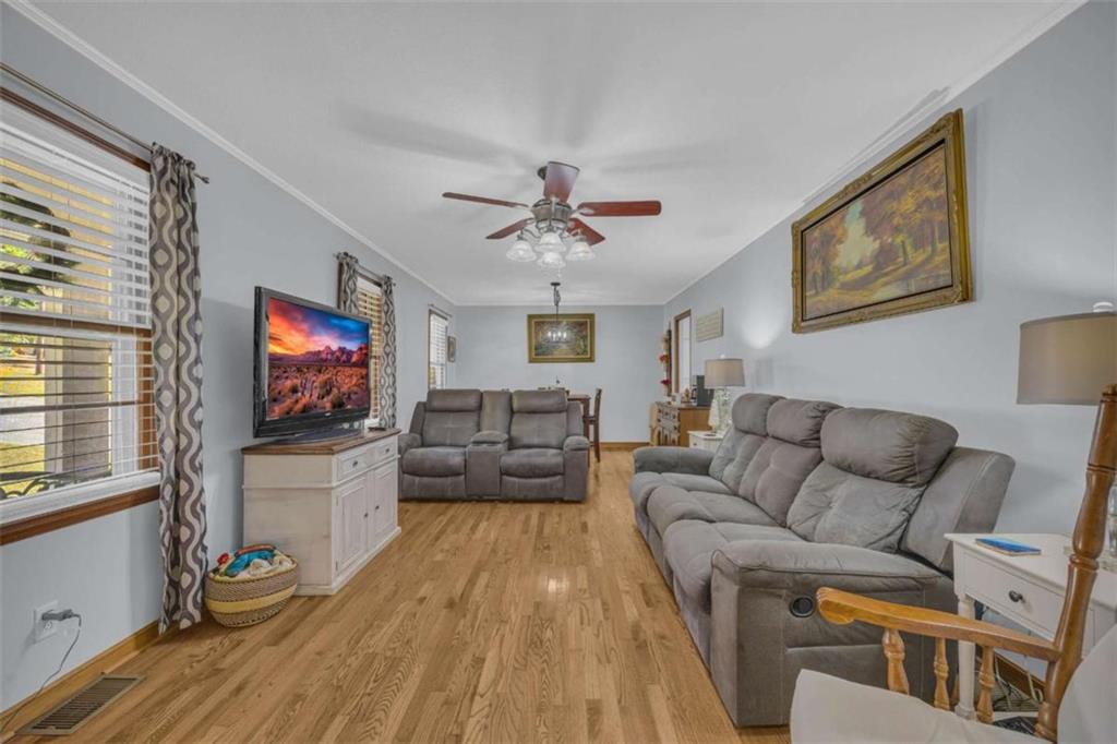 97 Williams Street Toccoa, GA 30577 - Photo 8 of 55 a living room with furniture and a flat screen tv
