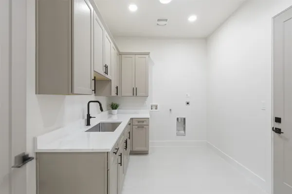 a kitchen with a sink and cabinets