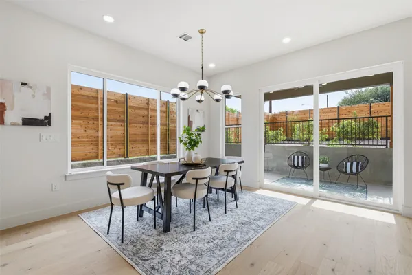 a view of a dining room with furniture window and outside view